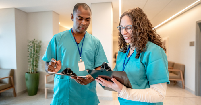 nurses going over tasks during a shift