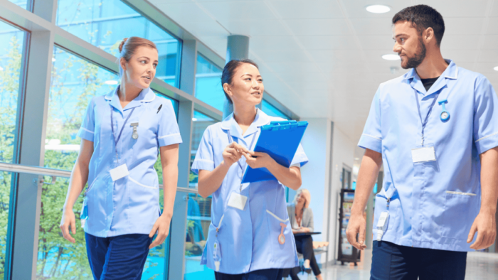 well organized nursing home staff walking through the facility