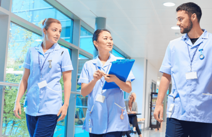 well organized nursing home staff walking through the facility
